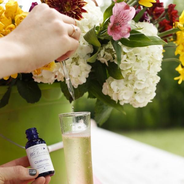 Celebration vibrational essence dropper bottle with flowers representing joyful energy healing and holistic medicine