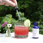 Forever Young essence being dropped into a drink for holistic medicine and energy healing rejuvenation