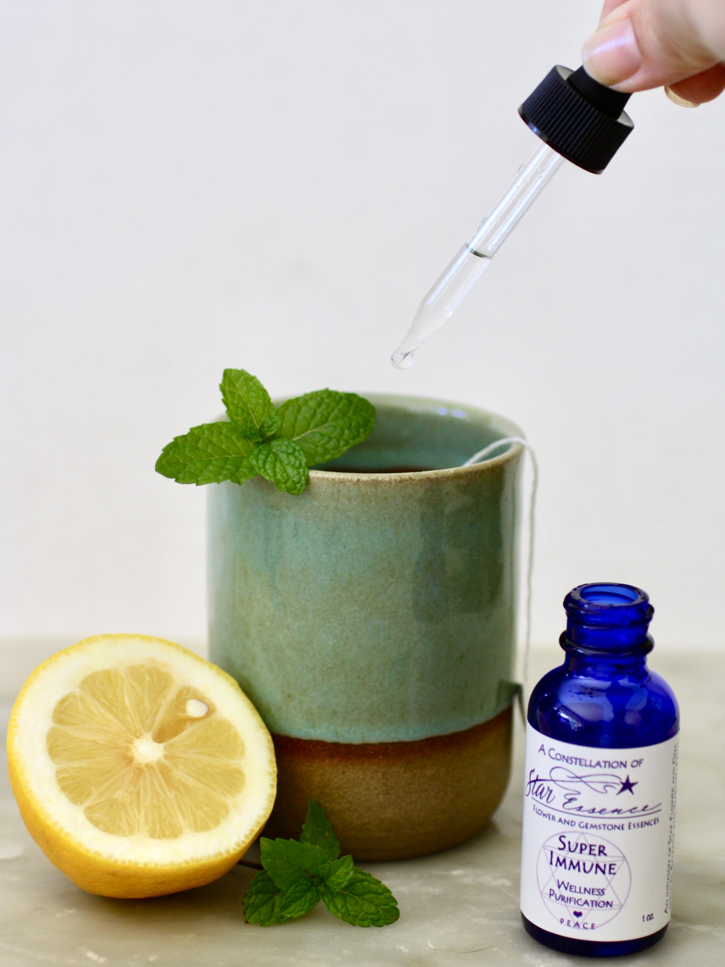 Super Immune flower essence being used with lemon and mint tea for energy healing and immune wellness